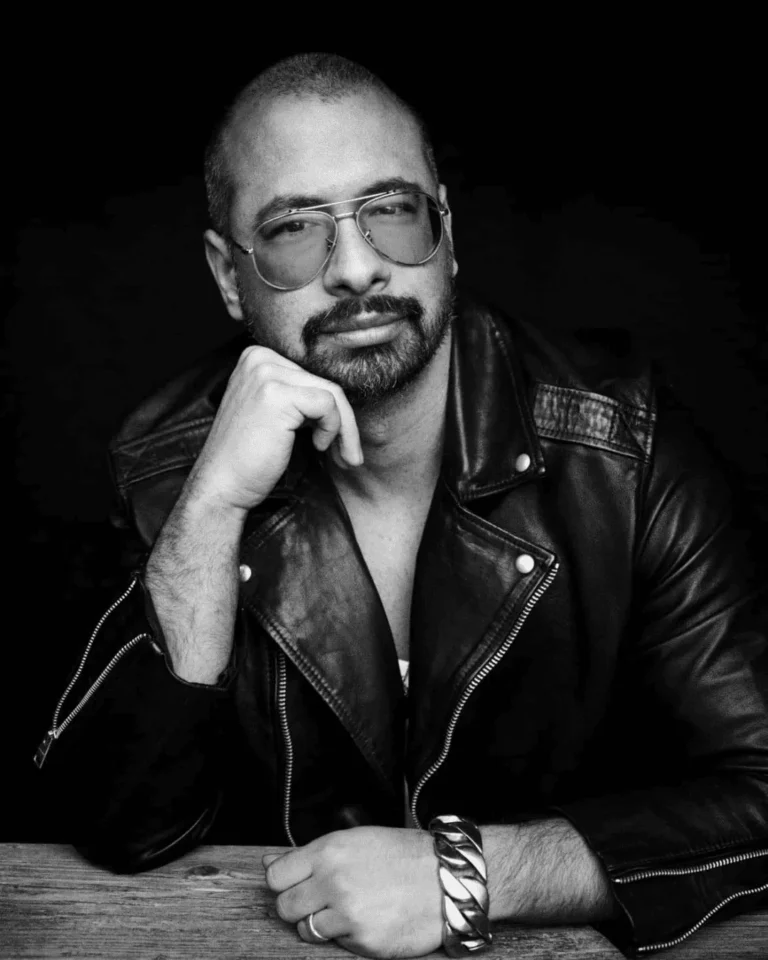 Pablo Kuemin, hairstylist and founder of Hair Mastery, portrait in a leather jacket, black and white